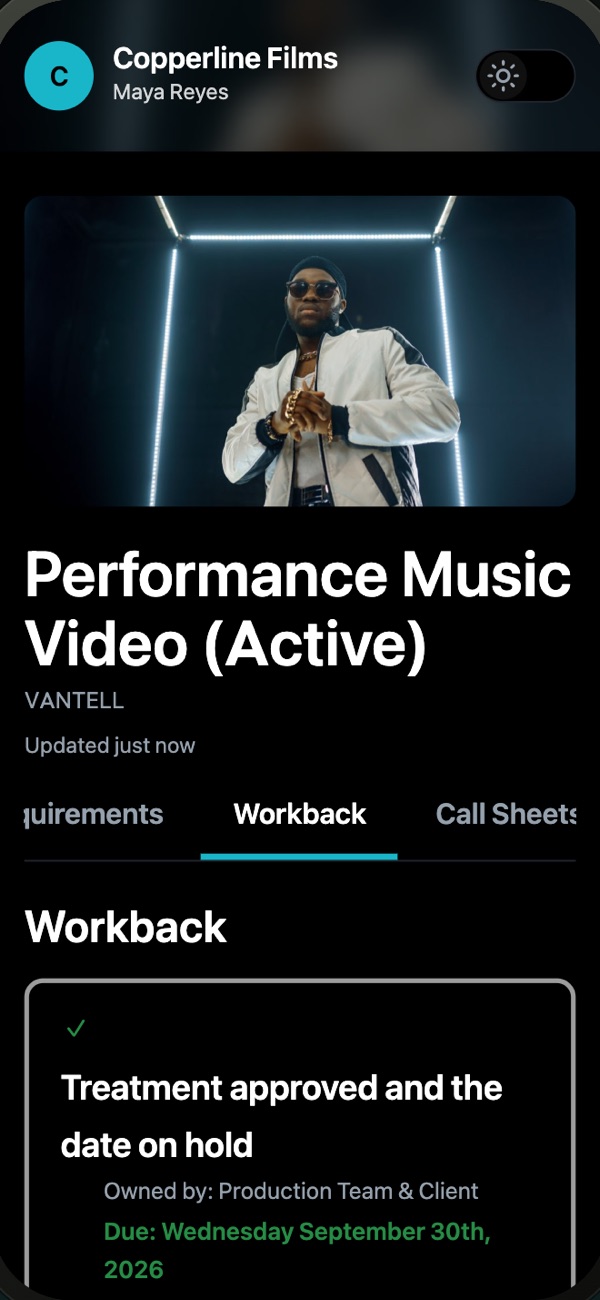 A client link on a phone, open on the music video's workback schedule